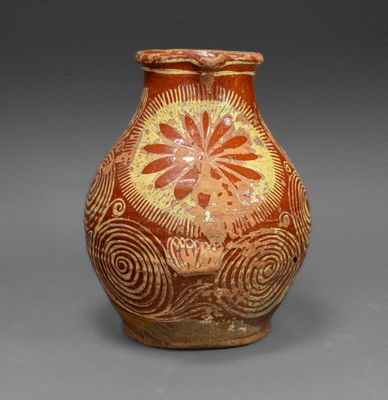 une image représentant un vase orné d'un motif floral
