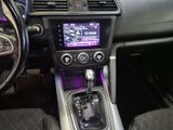 the interior of a car with a steering wheel and dashboard controls