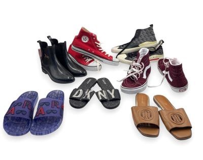 Plusieurs paires de chaussures sont alignées sur une surface blanche