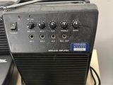 a radio sitting on top of a table next to a remote