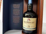 the bottle of redbreast 21 years old is in a wooden case