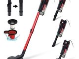 a close up of a red vacuum cleaner with four different tools