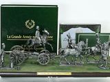 a display of various items that include a horse drawn carriage and other items