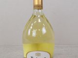 the bottle of wine is sitting on the table ready to be filled