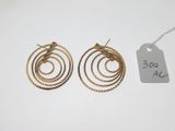 a pair of goldtone hoop earrings with twisted wire