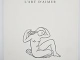 a white book with a drawing of a woman sitting on the ground