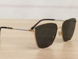 a pair of sunglasses sitting on top of a wooden table