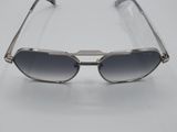 a pair of sunglasses sitting on top of a white table