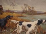 two dogs that are standing in the grass by the water