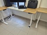 a suitcase sitting on a desk next to a computer monitor