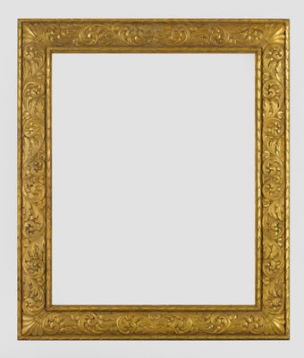 un cadre doré orné d'un motif décoratif sur fond blanc