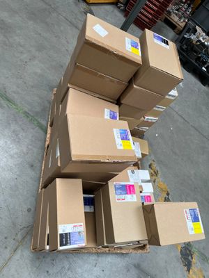 several boxes are stacked on top of each other in a warehouse
