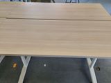 a table that has two pieces of wood on top of it