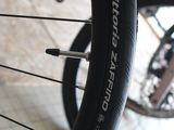 a close up of a bicycle tire on the ground