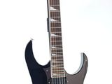a black electric guitar on a stand on a white background