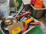 a lot of kitchen utensils sitting on a counter