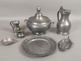 a lot of silver items that are on a table