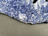 a blue and white rock with a black star on it