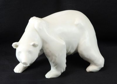 a white bear figurine on a black background
