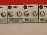 four different types of electrical switches are lined up against a red wall