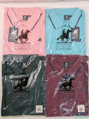 four polo shirts in different colors and designs on a table