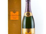 an image of a bottle of champagne next to a box of wine