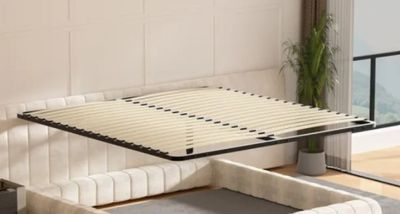 a bed that has a wooden slats on top of it