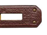 a close up of a brown leather door handle on a white background