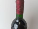 a bottle of wine that is sitting on a table