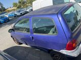 a blue car that is parked in a parking lot