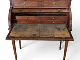 an old wooden desk with a mirror top on top of it