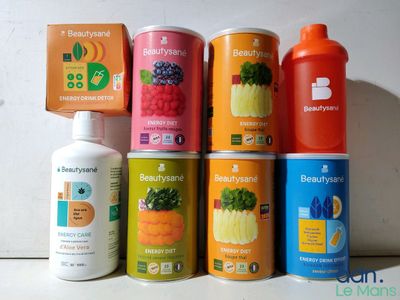 a lot of different types of juices on the counter