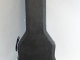 an image of a guitar case sitting on top of a white surface