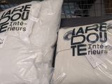 two bags of flour sitting next to each other on a table