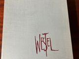 a picture of a book with a red writing on it