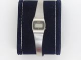 an image of a wrist watch sitting on top of a blue velvet case
