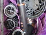a purple bag with a blow dryer and other items in it