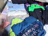 a pile of clothes on the floor next to a door