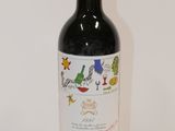 a bottle of wine that is sitting on a table