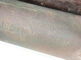 a close up view of a couple of old metal pipes