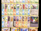 a lot of pokemon cards that are on the table