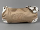 a chanel beige and white clutch bag