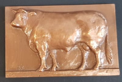 a chocolate mold of a cow on a table