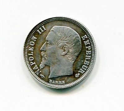 a close up of a coin with a man ' s face on it