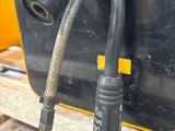 a hose attached to the back of a truck