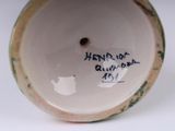 a close up of a vase with writing on it