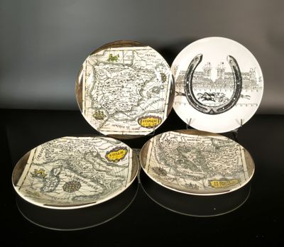 three plates with a map on them sitting on a table