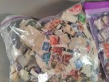 two bags of stamps sitting next to each other on a table