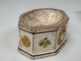 a small bowl that has a design on the inside of it
