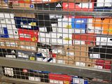 a metal rack with many boxes on top of it